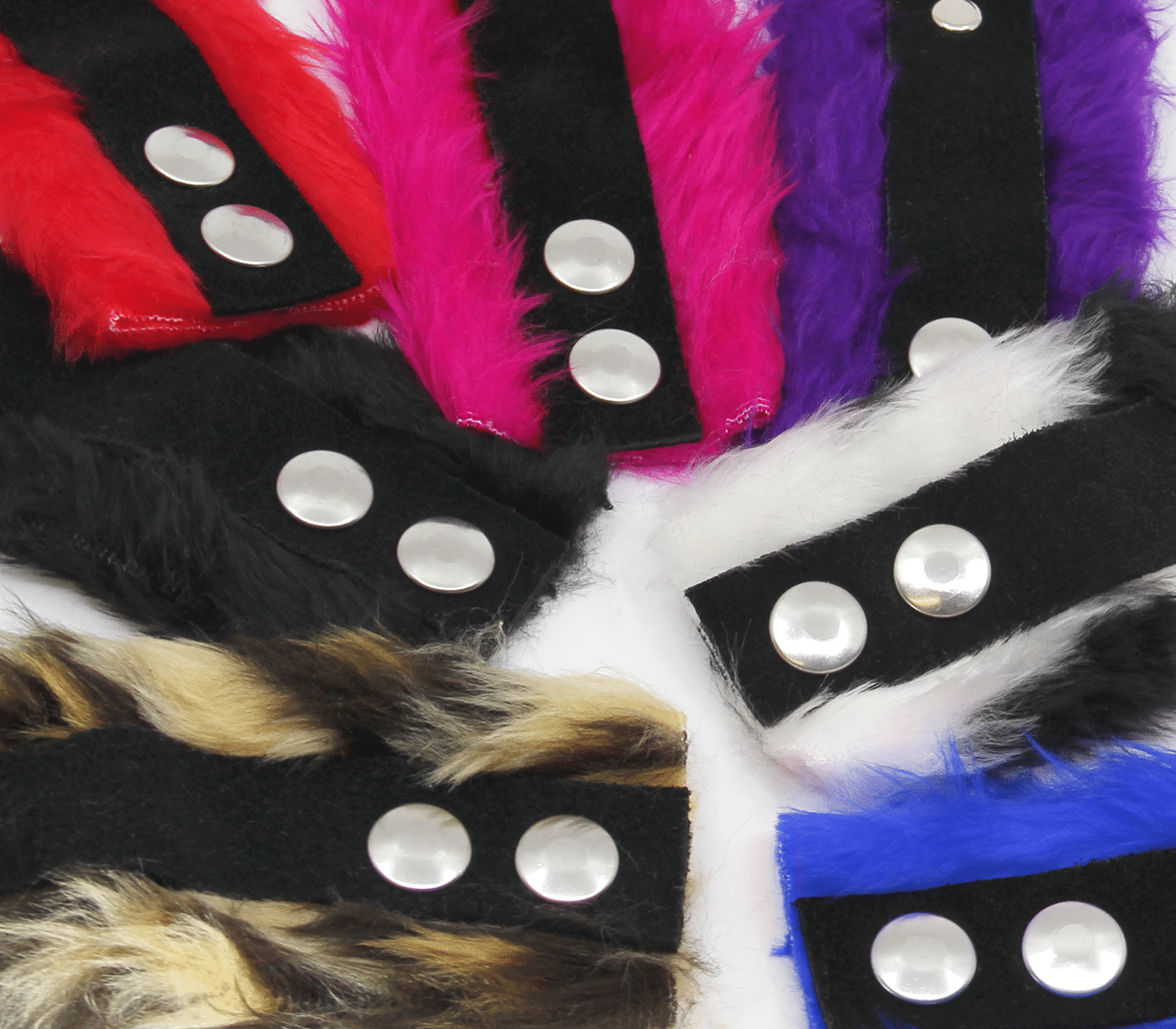 Close up of fluffy cuff wrist cuff materials, striped brown, black, red, pink, purple, black and white and blue swatches.