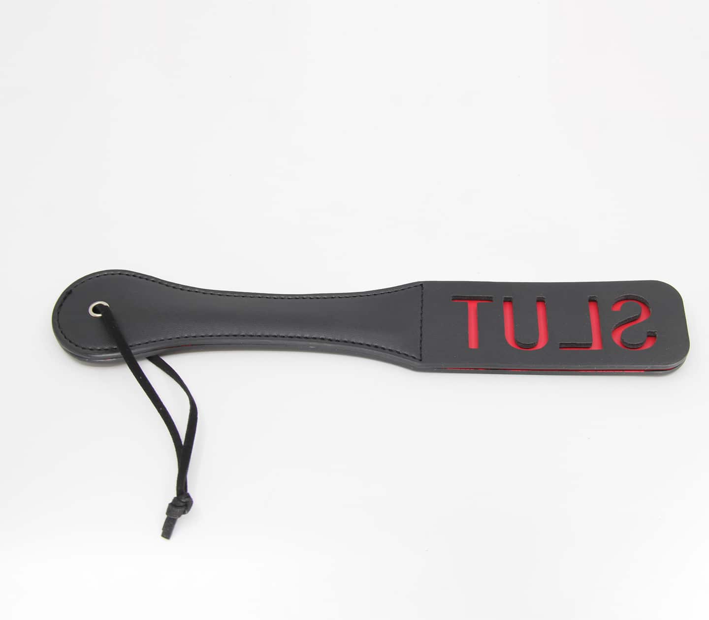 black pu paddle with red word cutout slut