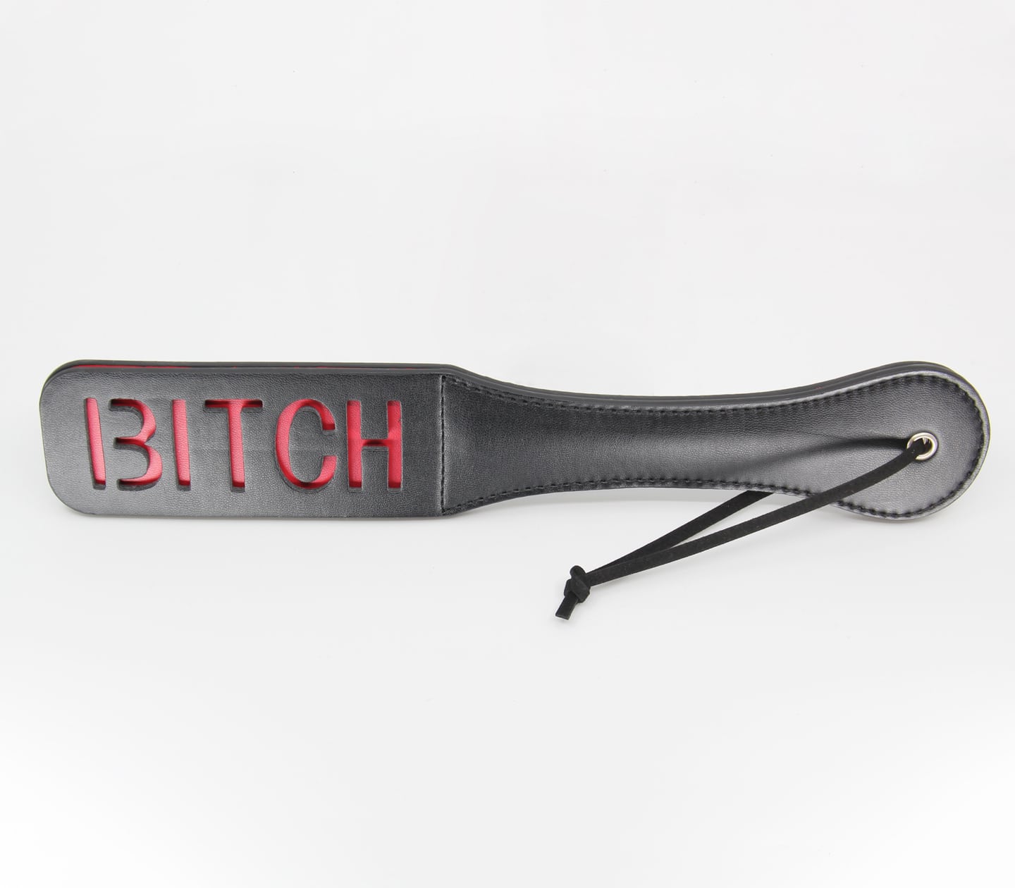 black pu paddle with red cut out word bitch