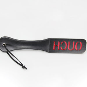 black pu paddle with red word ouch cut out